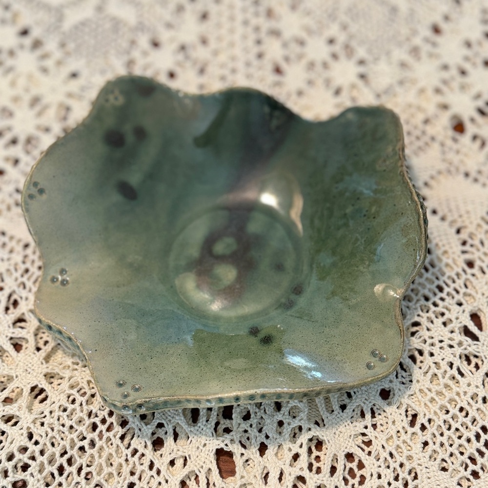 signed handmade pottery bowl/dish/tray with a wavy edge and green glaze